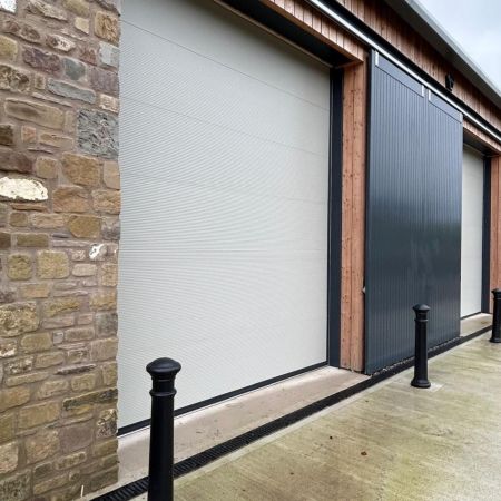 Sectional overhead doors to secure 4 units Sectional overhead doors to secure 4 units